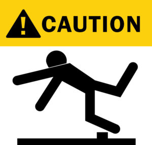 Warning of trip and fall accident graphic image in bold yellow and black